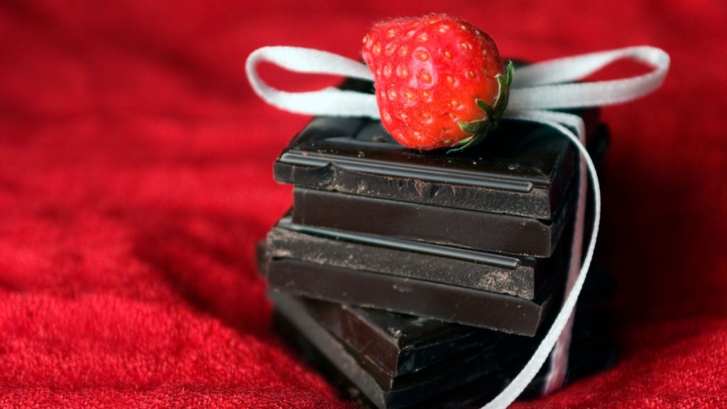 Dark chocolate bricks with strawberry and ribbon with aesthetic red background strawberry wallpapers for laptop