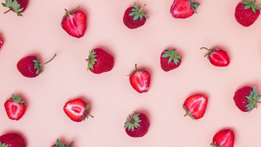 Half red strawberries with teal pink background strawberry desktop wallpaper