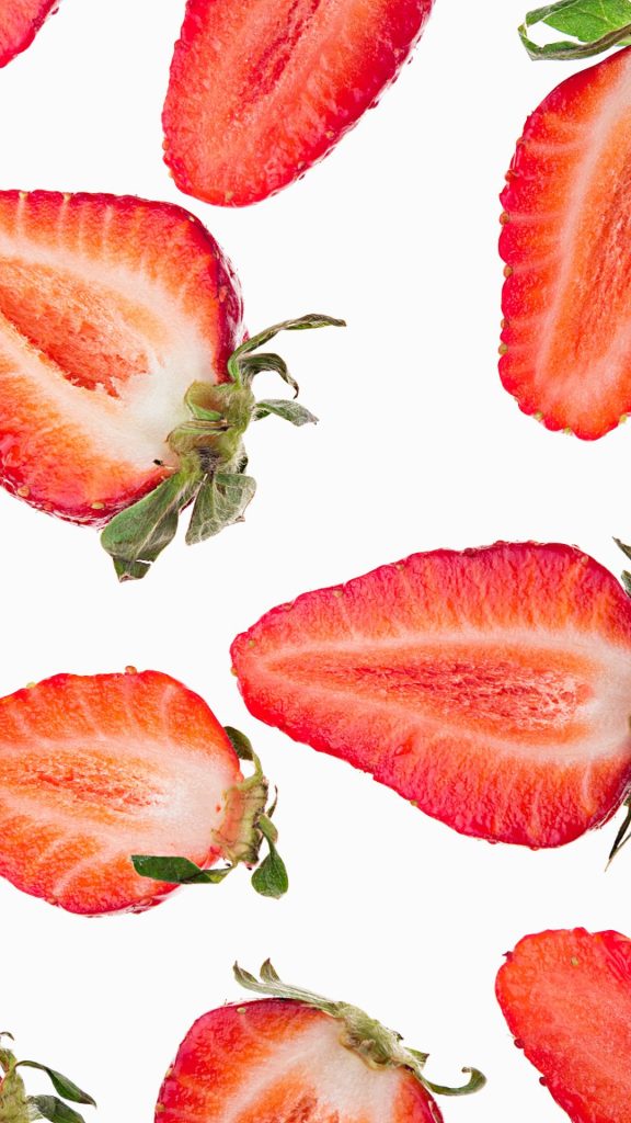 Half strawberries on white background strawberry phone wallpaper