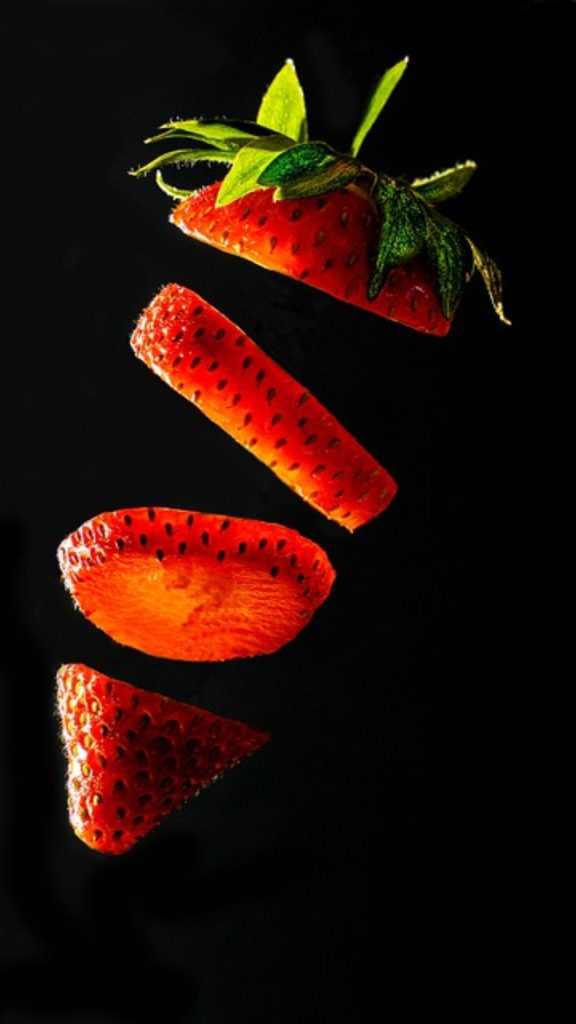 Minimal red strawberry with black background strawberry phone wallpaper