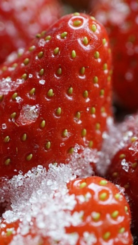 Red juicy strawberries with sugar crystals strawberry phone wallpaper