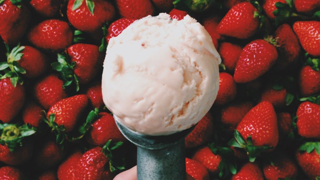 Scoop of ice cream with strawberry background strawberry wallpaper for laptop