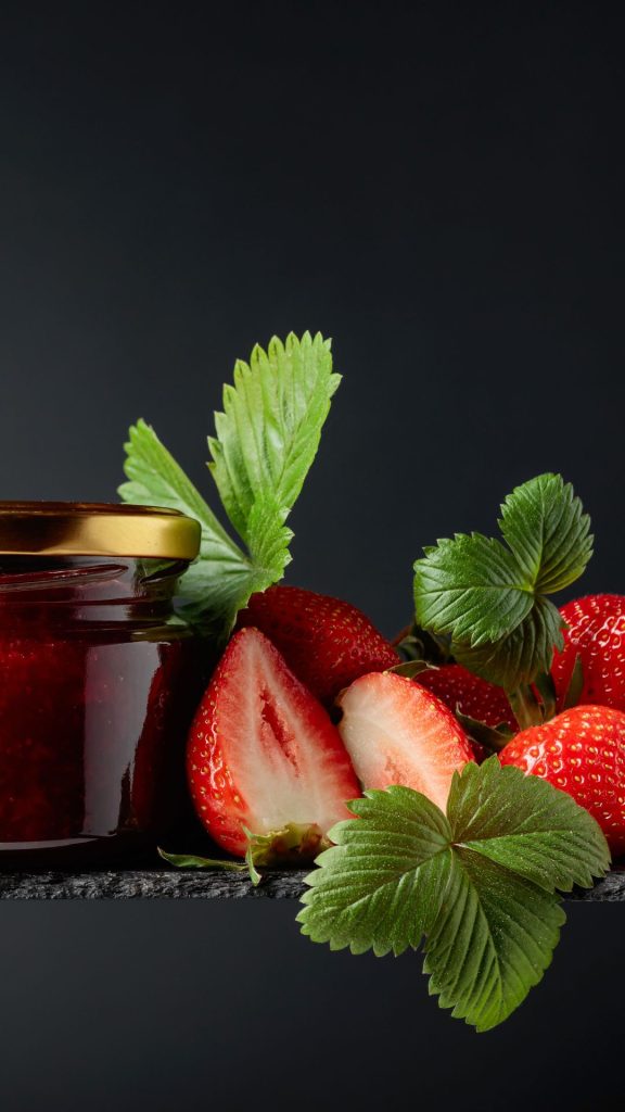 Strawberries with jam jar on granite with black background strawberry phone wallpaper