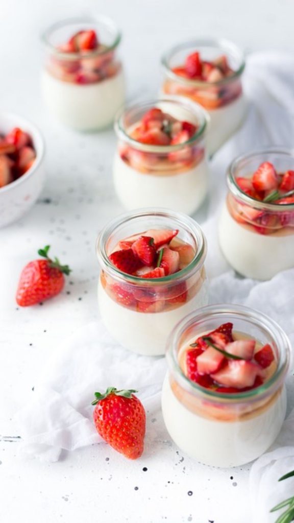 Sweet strawberry treat cups with white blurred background strawberry phone wallpaper
