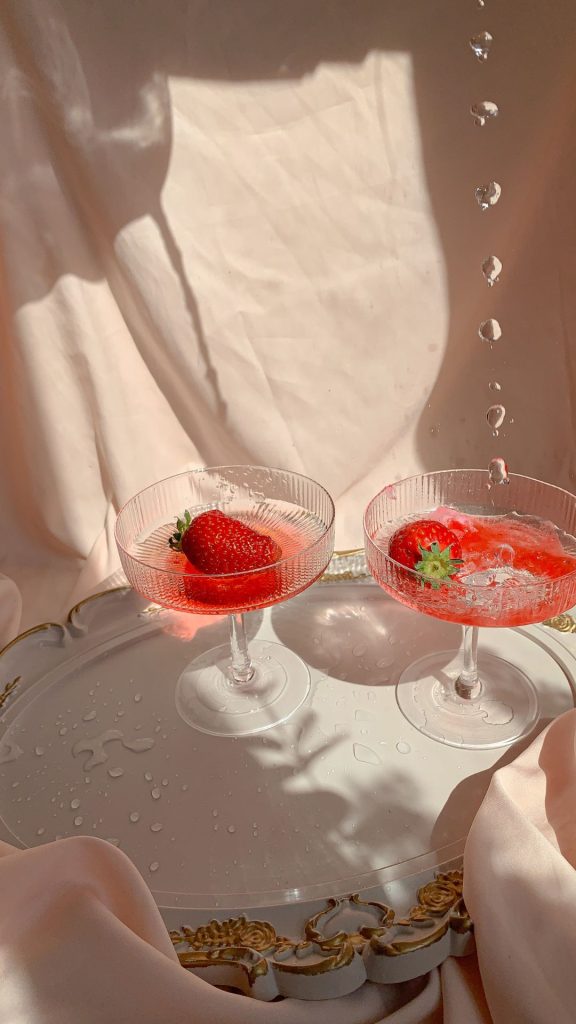 Aesthetic photograph with strawberries in vine glass with cocktail strawberry wallpaper for I phone