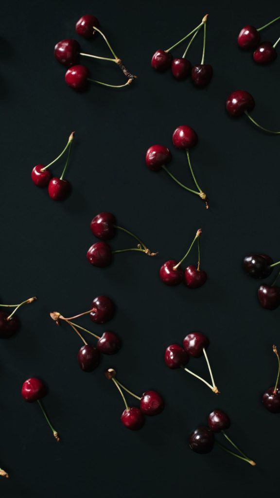 Cherries in red shades with dark aesthetic black background aesthetic cherry wallpapers
