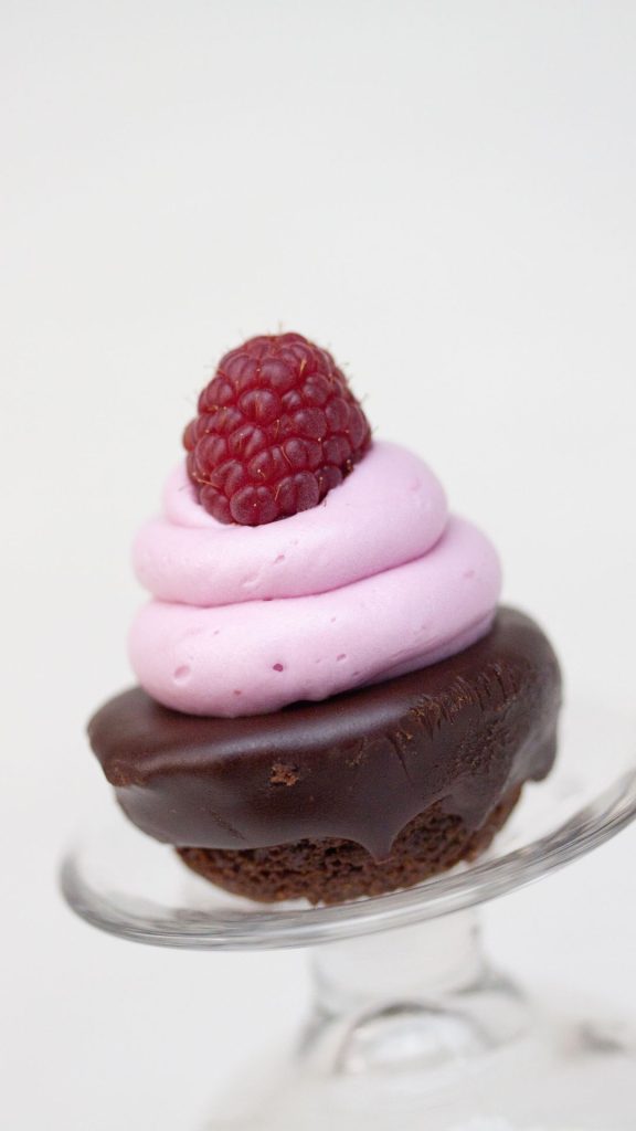 Chocolate cupcake with strawberry cream and strawberry pastel pink strawberry wallpaper