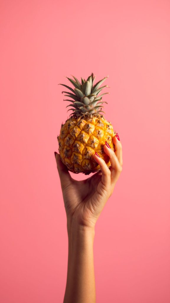 Cute little pineapple in girls hand with cute baby pink background Pineapple wallpaper