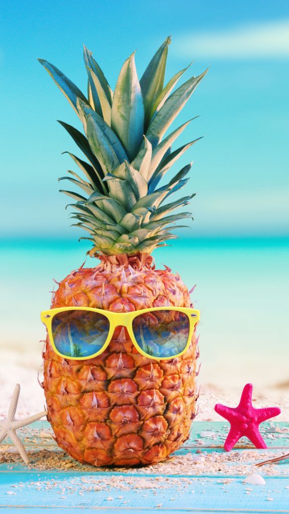 Cute pineapple with glasses on beach with star fishes and sky background Pineapple wallpaper