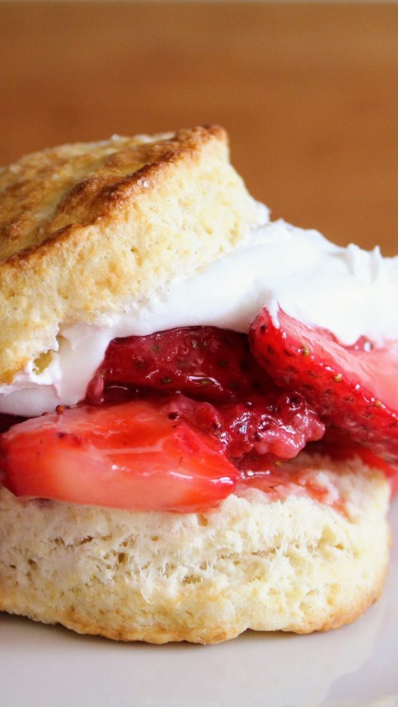 Delicate shortcake with jam dipped strawberries and cream strawberry shortcake wallpaper