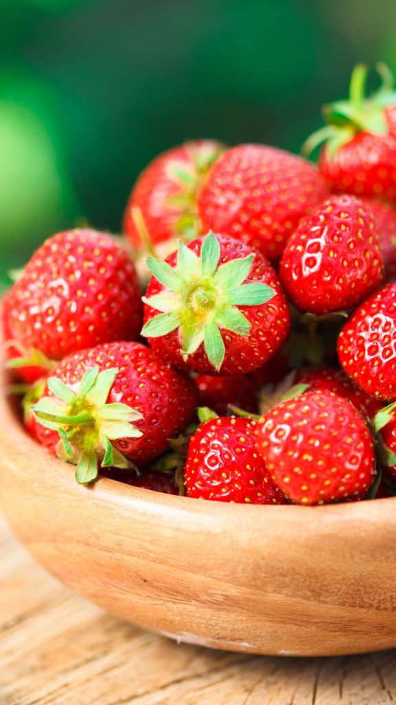 Juicy red strawberries in wooden bowl Strawberry Background Wallpaper