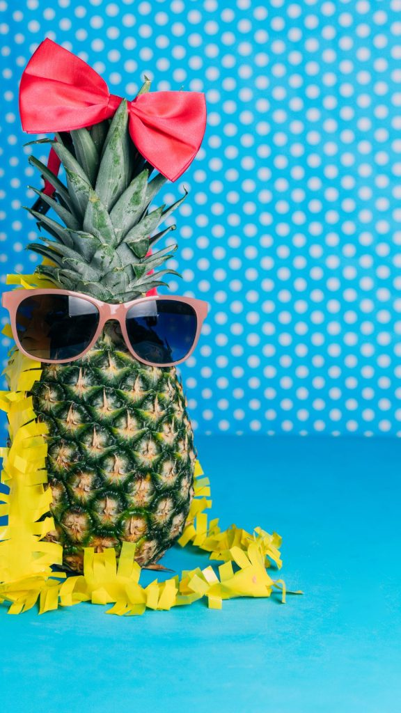 Pineapple with glasses and pink bow with sky polka dots background Pineapple wallpaper