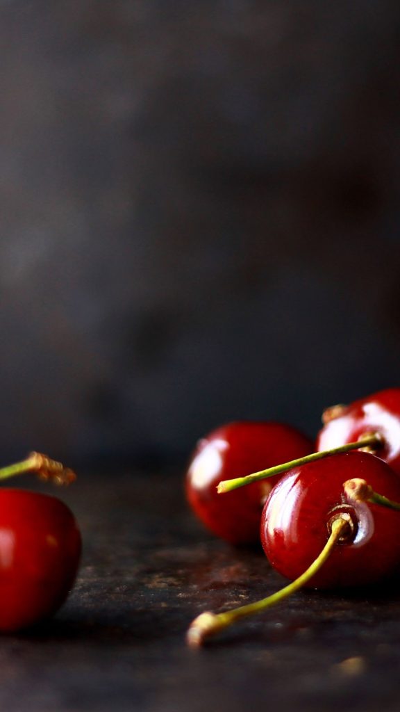 Red glassy and juicy cherries with vintage grey background aesthetic cherry wallpapers