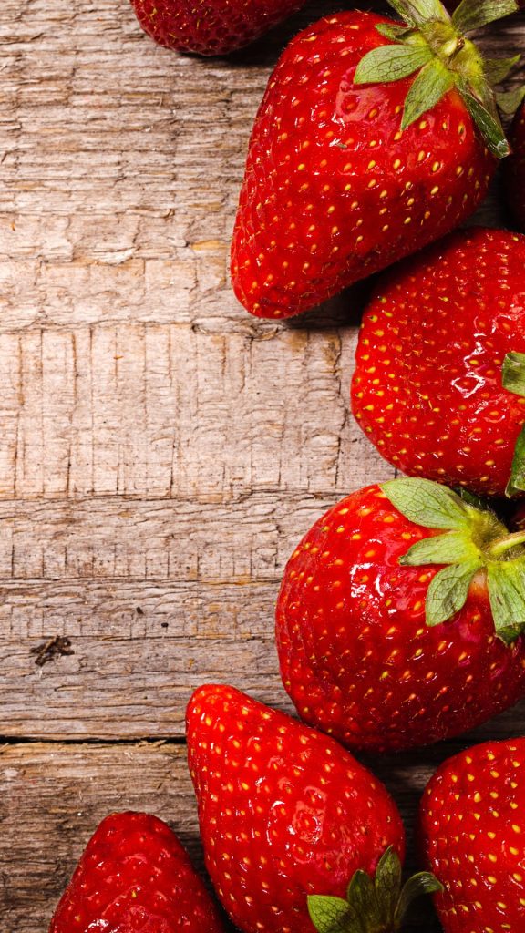 Red strawberries placed on wooden table strawberry wallpaper for I phone