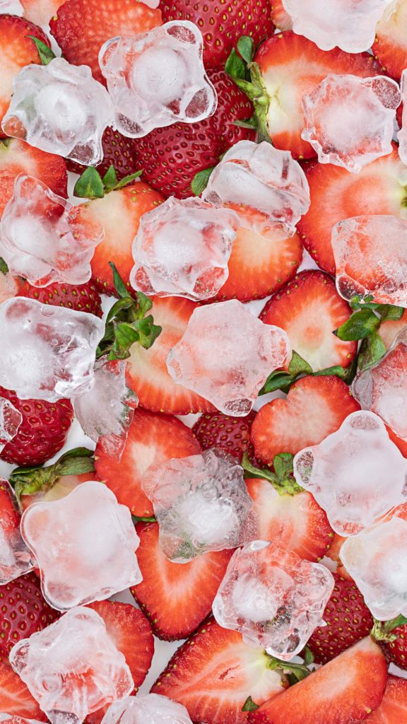 Strawberries with ice cubes Strawberry Background Wallpaper