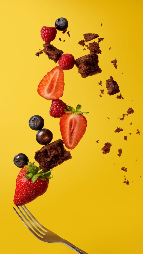 Strawberries with yellow background and Blueberries Strawberry Background Wallpaper