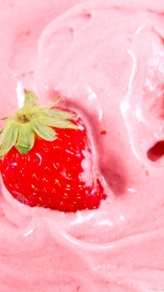 Strawberry in pink cream Strawberry Background Wallpaper