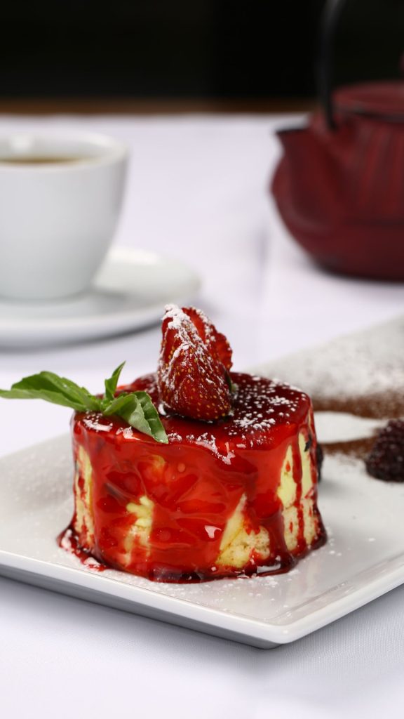 Strawberry sauce drizzled shortcake with blurred background strawberry shortcake wallpaper