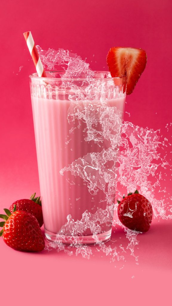 Strawberry with milkshake on dark pink background pastel pink strawberry wallpaper
