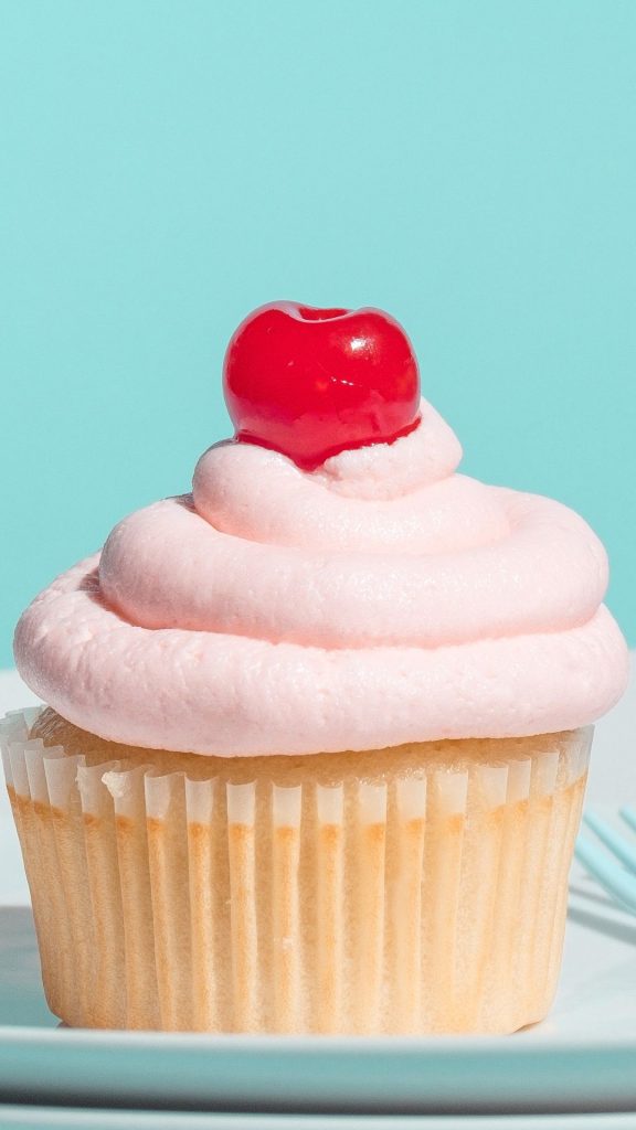 Sweet cupcake with cherry on top and sky background aesthetic cherry wallpapers