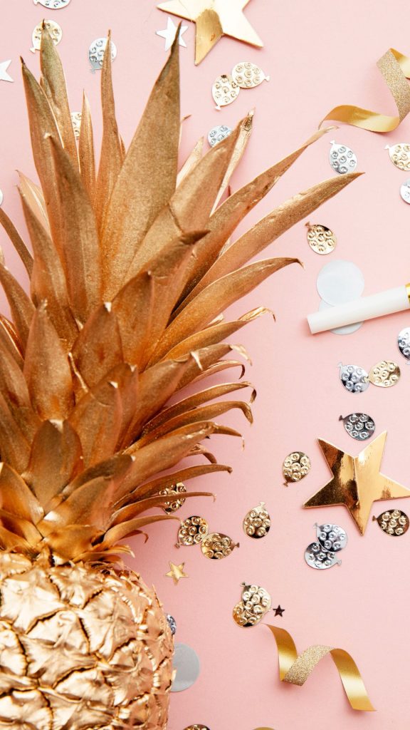 Sweet pineapple in golden colour with girly decorations on baby pink background Pineapple wallpaper