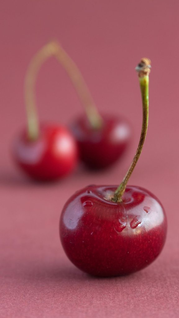 Sweetest cherries with baby pink background for girls aesthetic cherry wallpapers