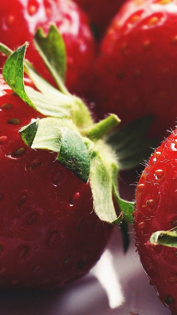 Zoomed picture of red juicy strawberries strawberry wallpaper for I phone