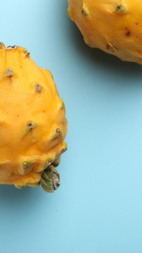 Aesthetic sky background yellow dragon fruit wallpaper