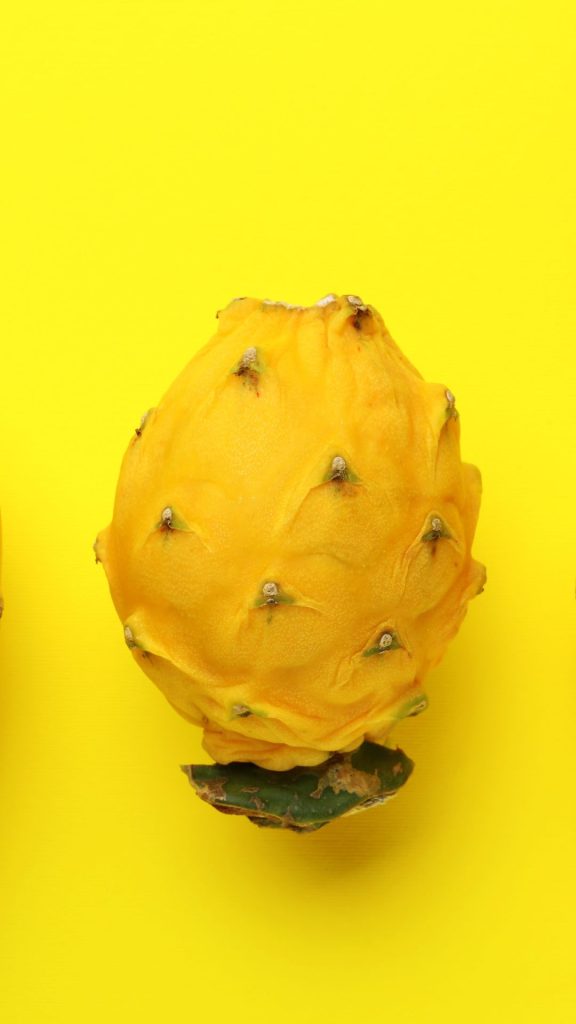 Aesthetic yellowish background yellow dragon fruit wallpaper