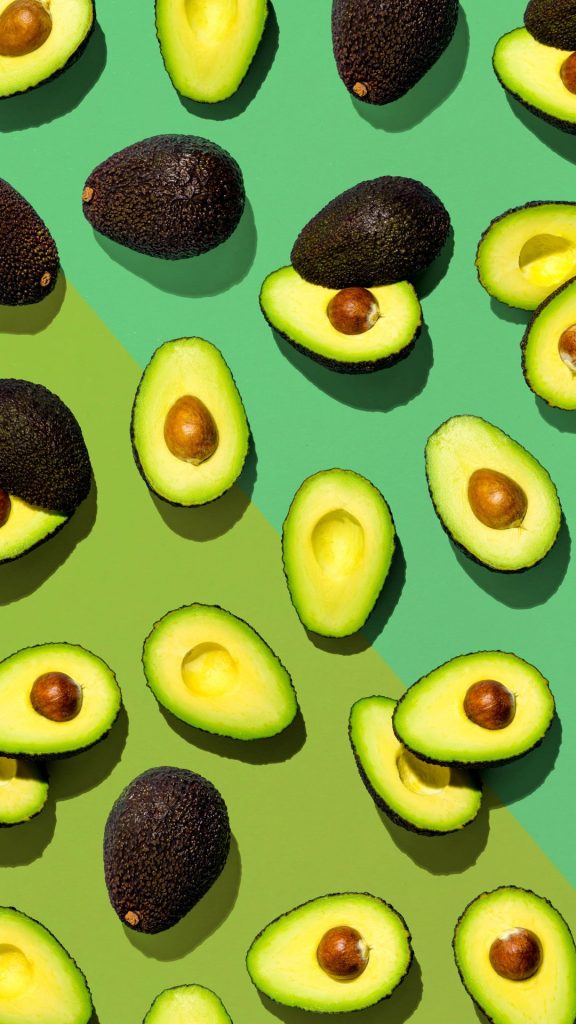 Avocado fruits with mint green and light green background avocado wallpaper