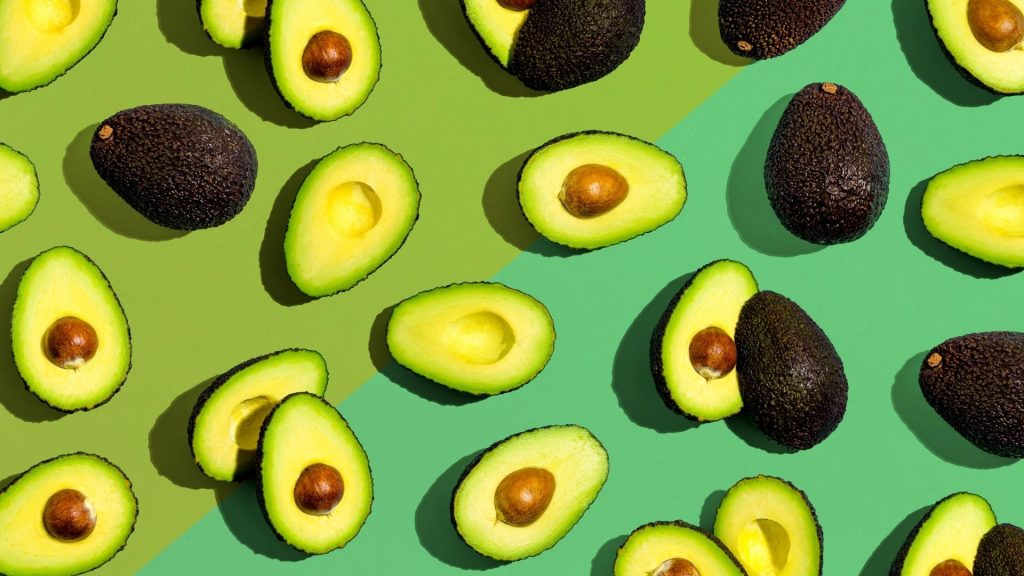 Fresh avocados with mint green and parrot green background avocado wallpaper