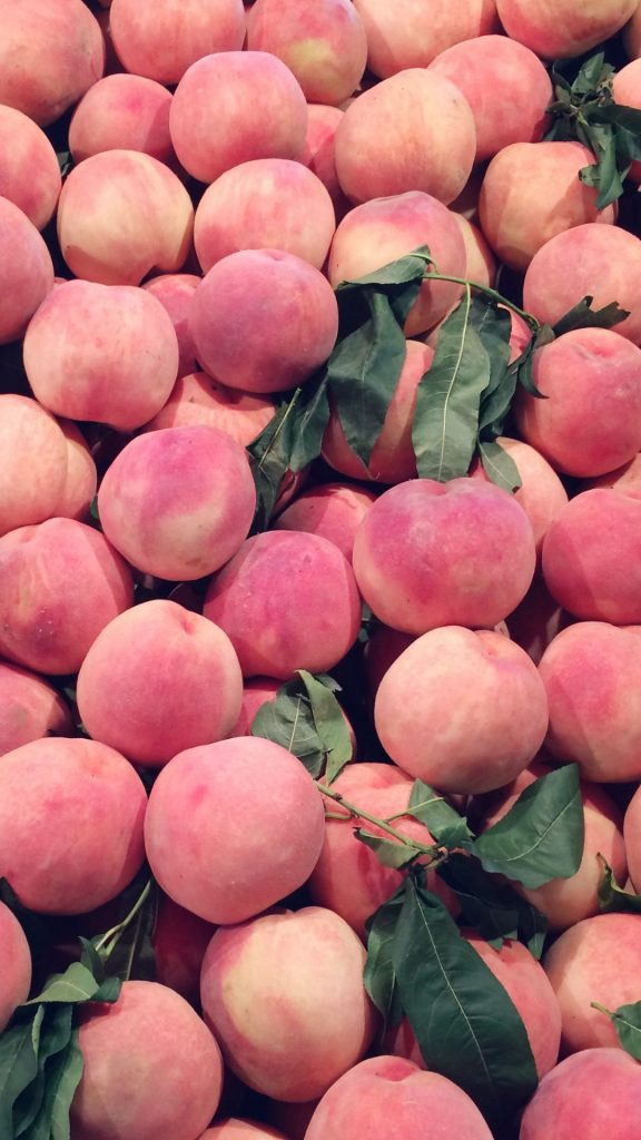 Fresh peaches with leaves peach wallpaper