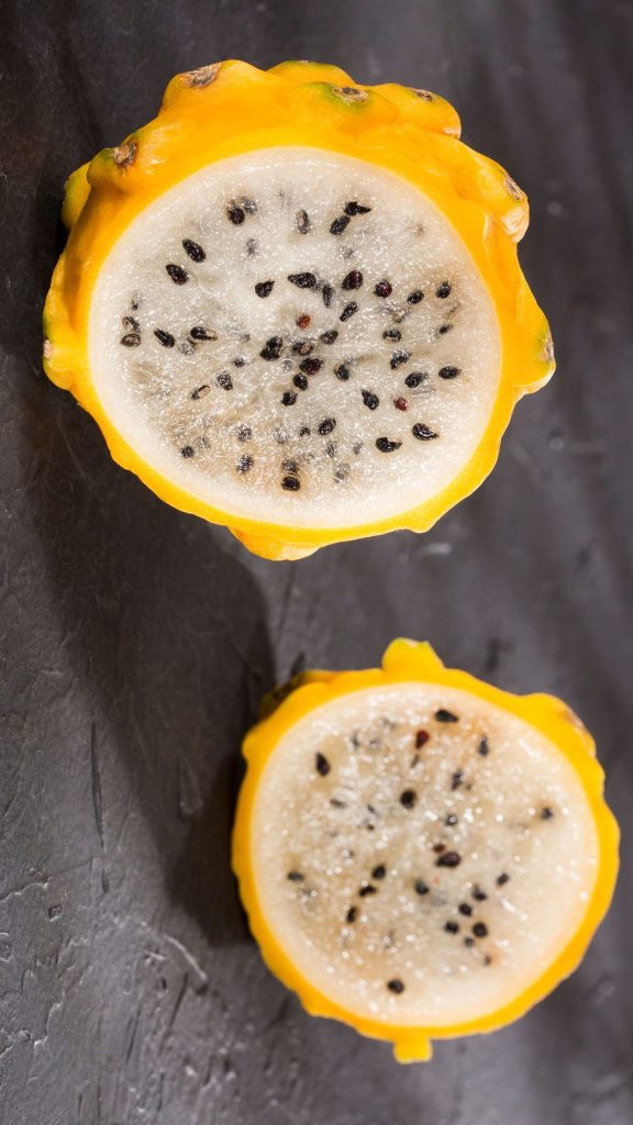 Grey background yellow dragon fruit wallpaper