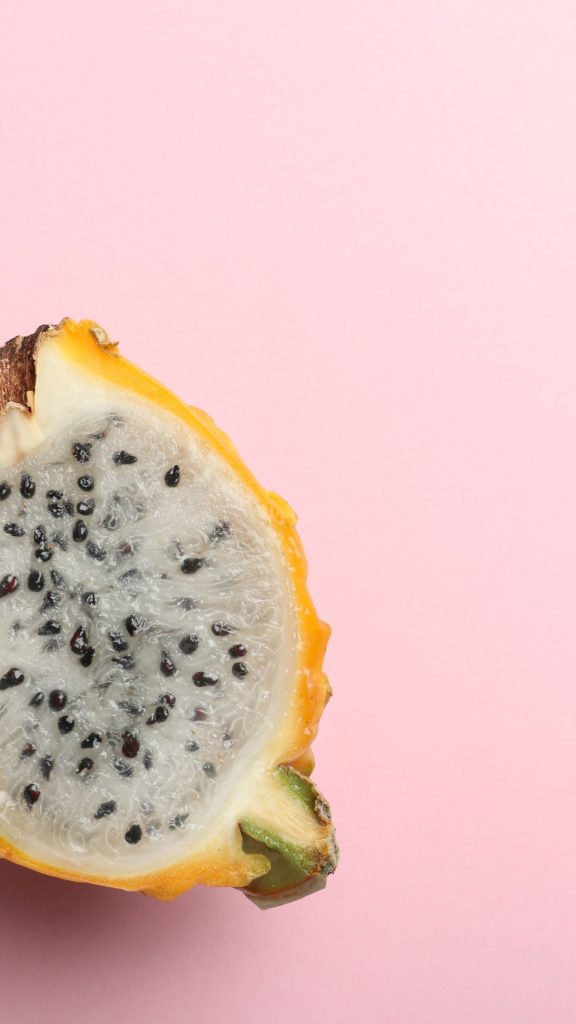 Pink background yellow dragon fruit wallpaper