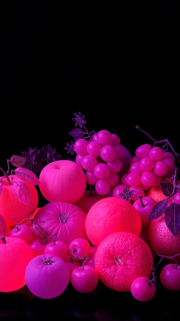 Pink fruits with glowing colour and black background blox fruits wallpaper