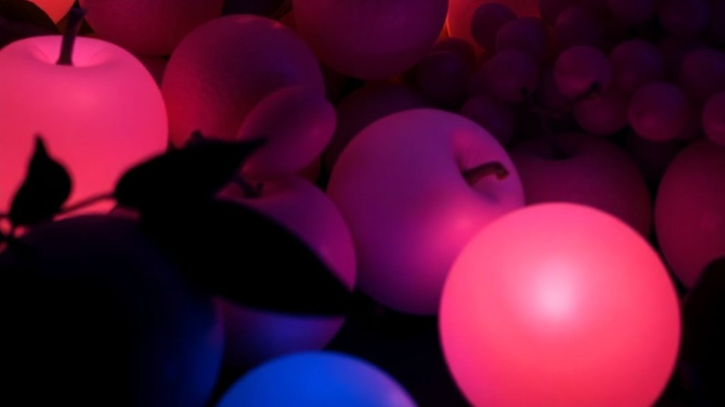 Pink glowing fruits with glowing background blox fruits wallpaper