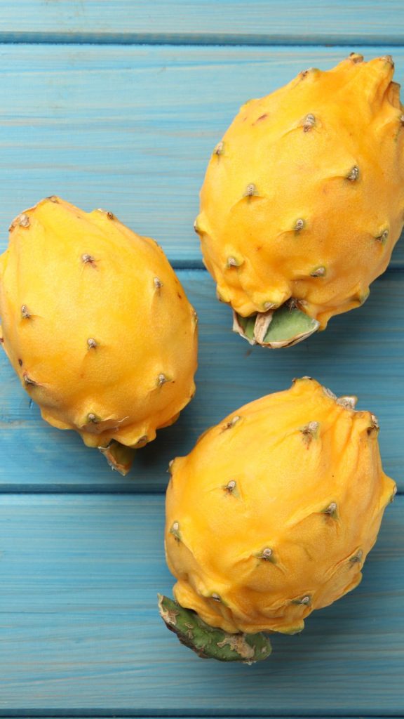 Sky wooden background yellow dragon fruit wallpaper