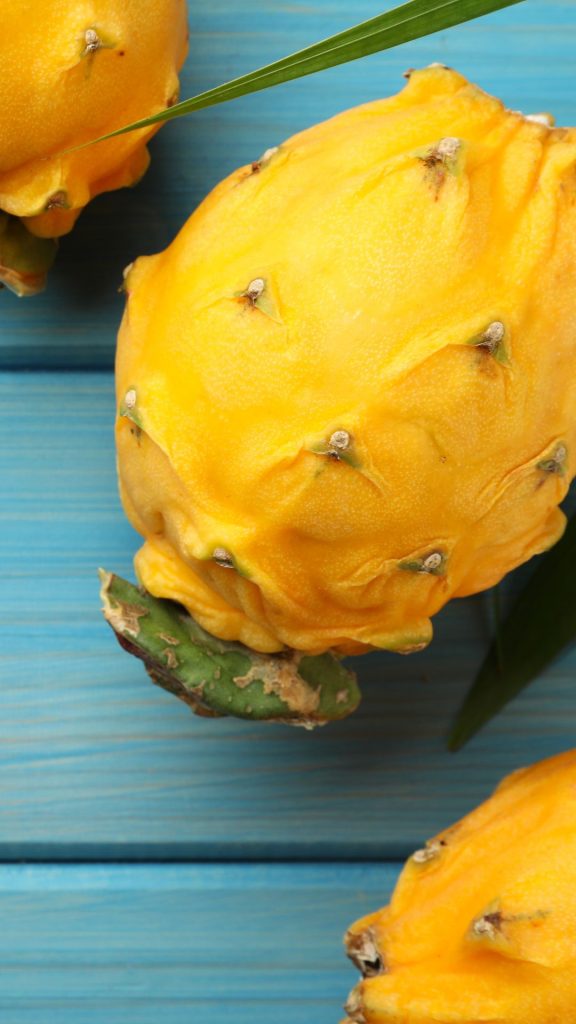 Vintage sky wooden background yellow dragon fruit wallpaper