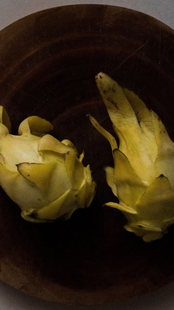 Vintage wooden background yellow dragon fruit wallpaper