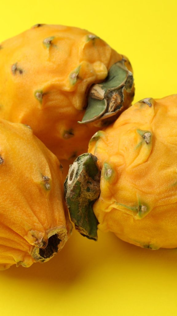 Vintage yellow background yellow dragon fruit wallpaper