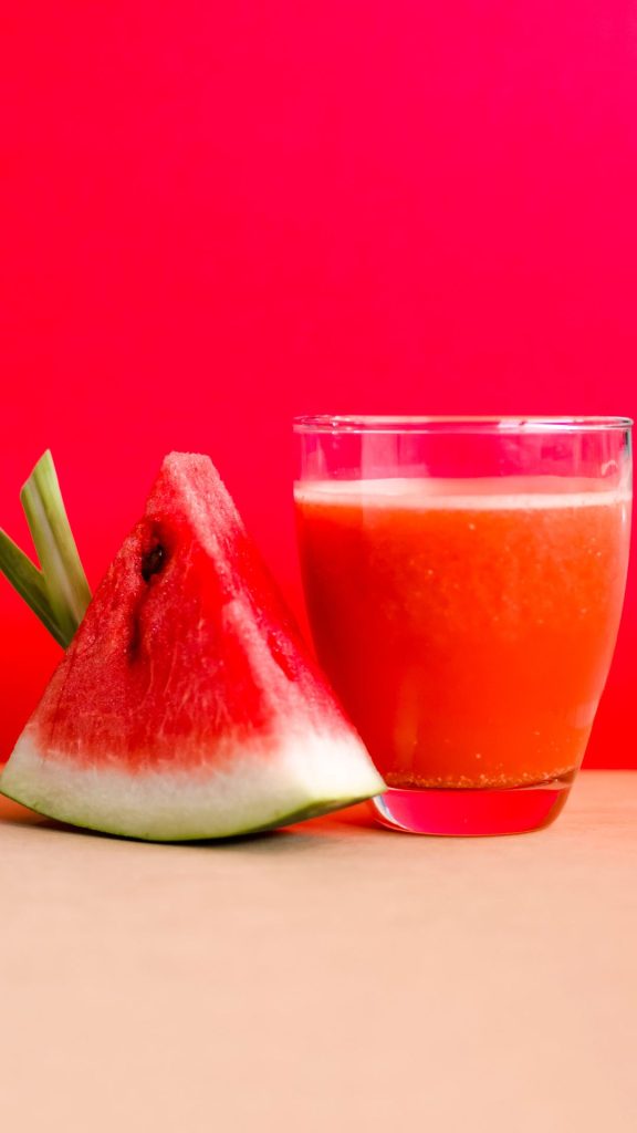 Watermelon piece with juice glass and pink background watermelon wallpaper