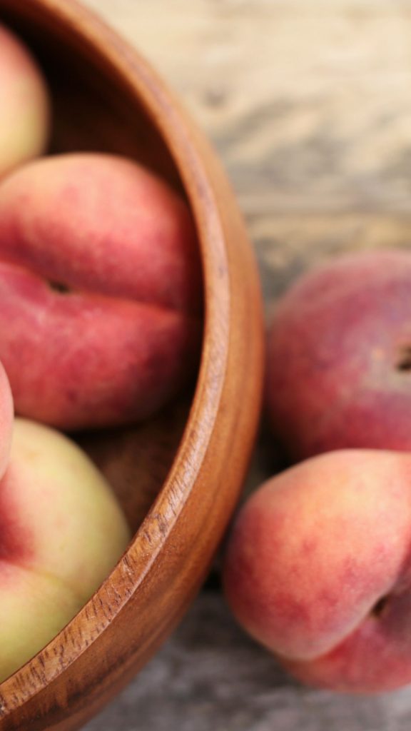 Wooden bowl peach wallpaper