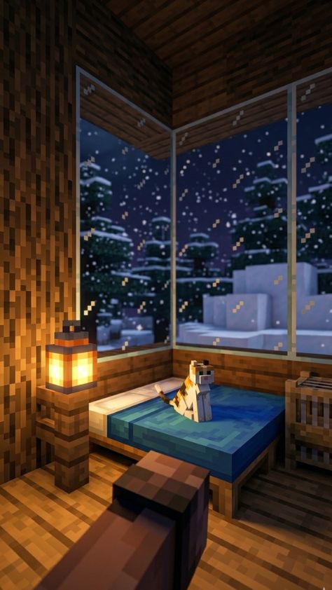 A cozy Minecraft bedroom with a calico cat on a blue bed overlooking a snowy forest Minecraft Wallpaper