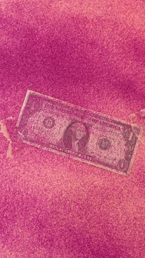 One-dollar bill buried in vibrant magenta glitter pink wallpaper