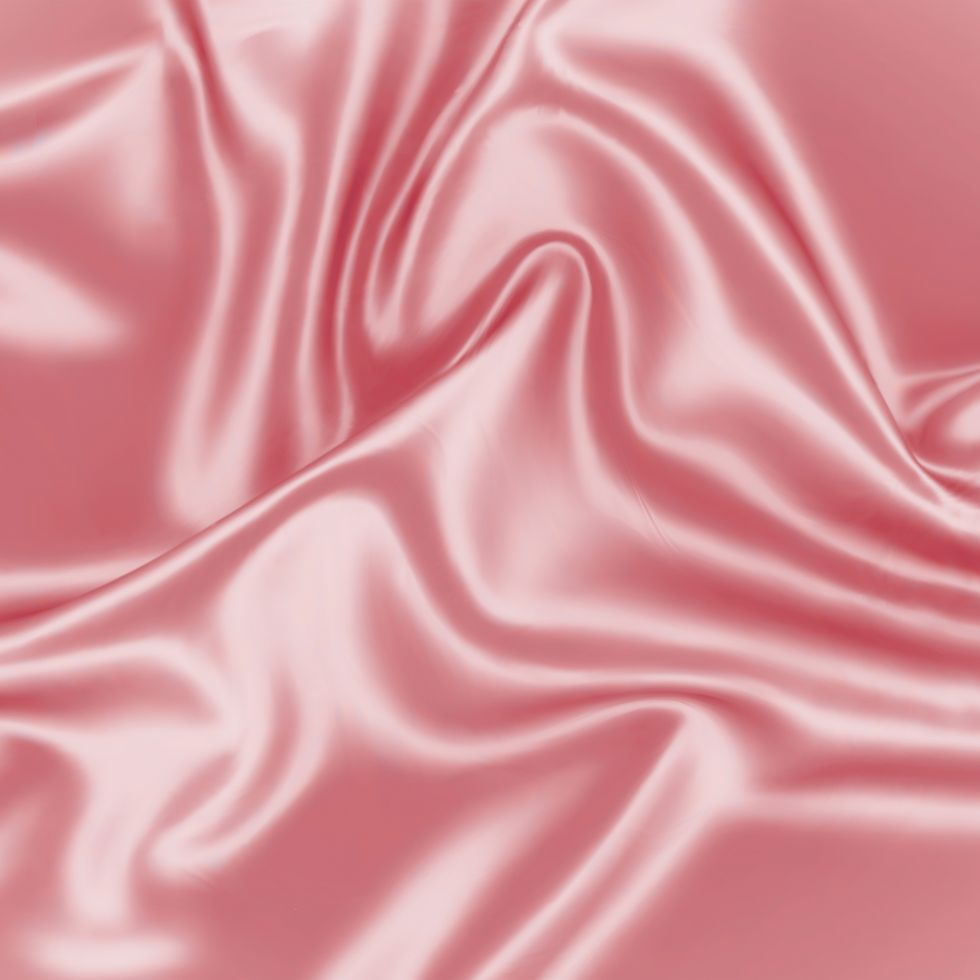 Elegant rippled silk fabric in a soft rose hue pink wallpaper