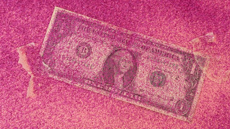 A one-dollar bill partially covered in a thick layer of vibrant pink sparkling glitter, preppy wallpaper