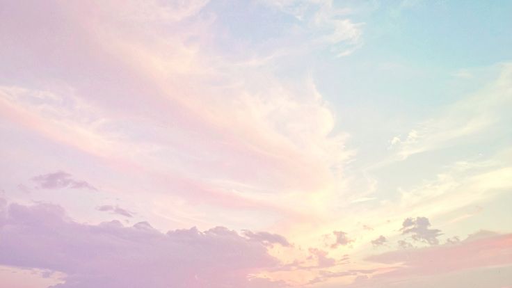 Soft pastel rainbow cloudscape on a bright day, preppy wallpaper.