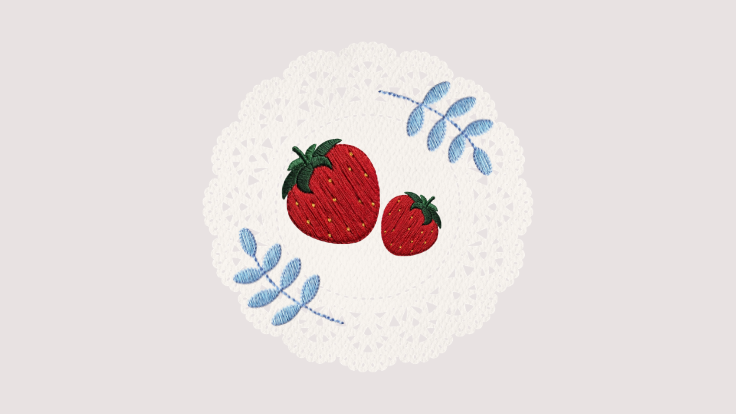 Embroidered red strawberries and blue leaves on a white lace doily strawberry cartoon
