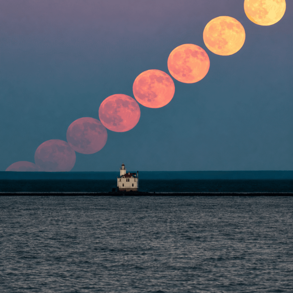 Lighthouse beneath a lunar sky