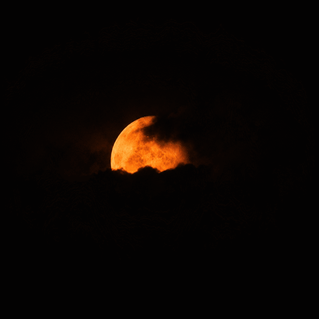 Moonrise through the misty clouds